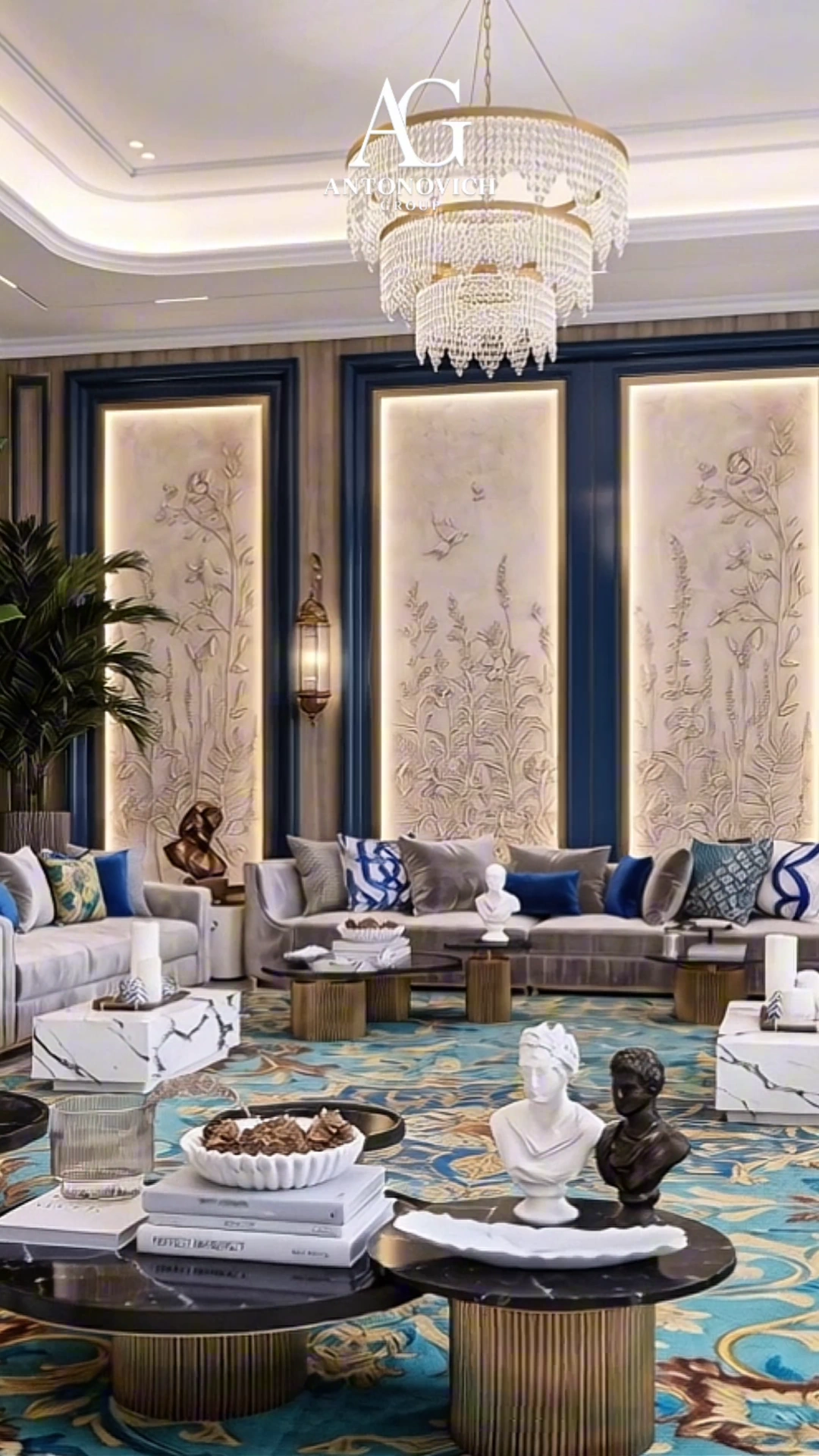 Classic majlis with a crystal chandelier, carved wall panels and a patterned blue carpet, designed by Antonovich Group