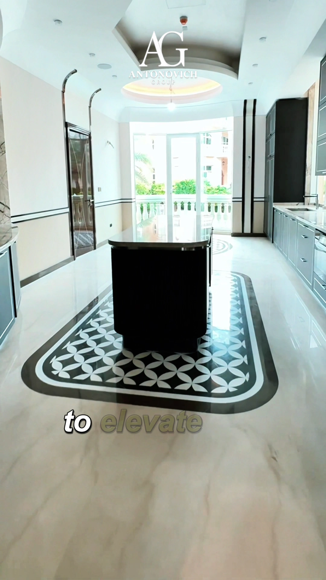Design consultation at the material library, then a dark fluted-wood island kitchen with a deep blue stone worktop and a crystal chandelier