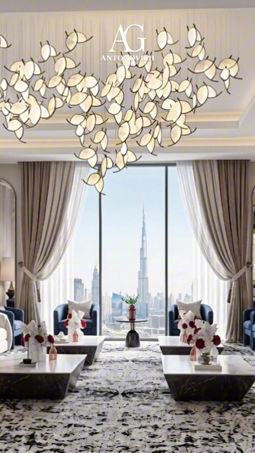 Modern majlis with a sculptural chandelier and a Burj Khalifa view, designed by Antonovich Group