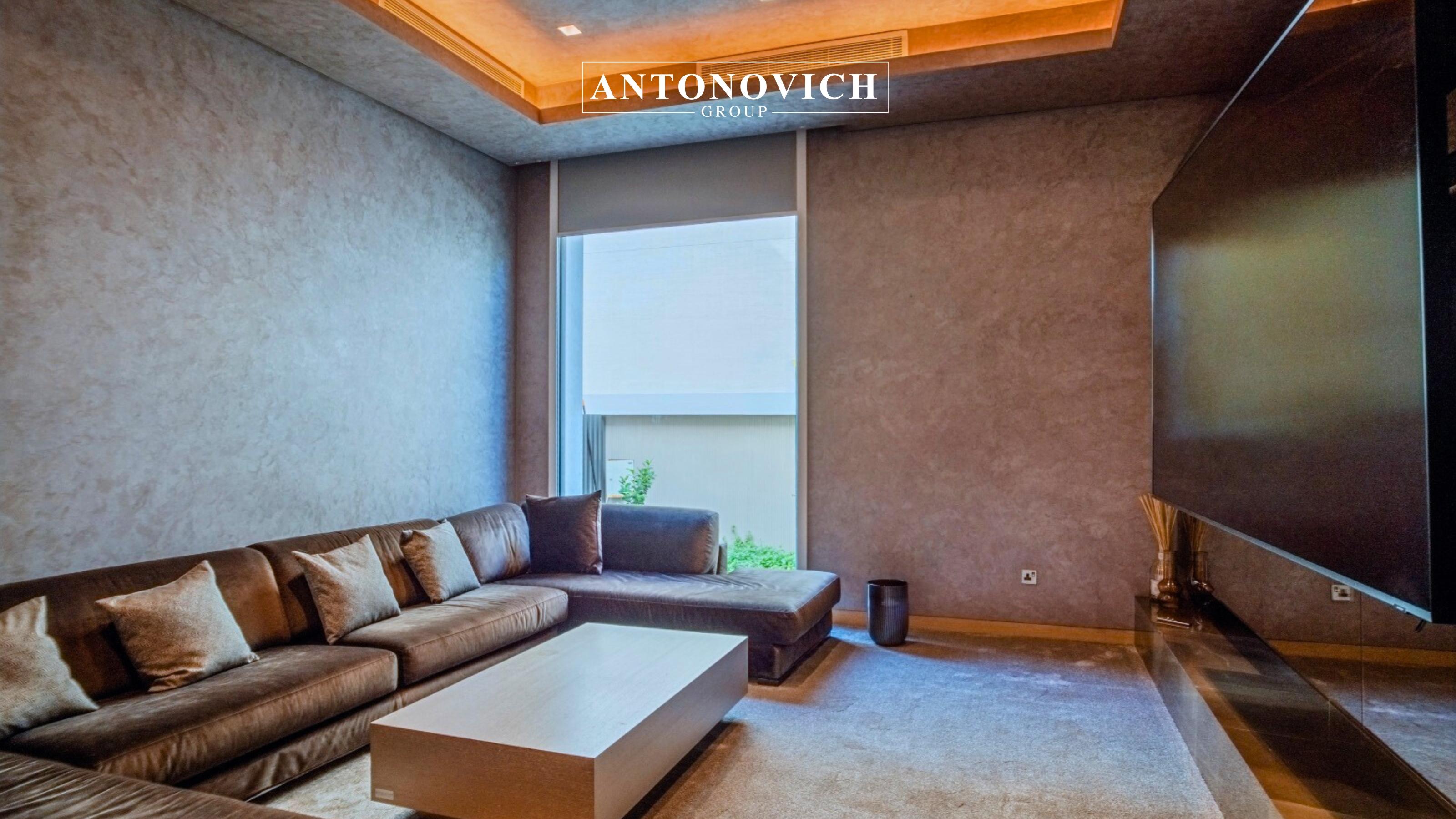 Bespoke Kitchen Joinery Solutions for Luxury Palm Jumeirah Villas Complementing the grand living room, the villa’s kitchen interior was designed as a refined extension of the modern luxury concept. Antonovich Group delivered a fully customized kitchen joinery solution tailored specifically for this Palm Jumeirah luxury villa, combining aesthetics, functionality, and precision craftsmanship. The kitchen features bespoke joinery, produced in Antonovich Group’s own furniture and joinery facilities, ensuring absolute control over quality and detailing. Custom cabinetry was designed with clean architectural lines, premium finishes, and seamless integration of high-end appliances. Natural wood veneers, lacquered panels, and stone countertops were carefully selected to harmonize with the villa’s modern interior palette. Every detail—from concealed storage systems to soft-close mechanisms—reflects Antonovich Group’s reputation as a leader in luxury kitchen design and joinery in Palm Jumeirah Dubai. The result is a kitchen that functions as both a high-performance culinary space and a sophisticated design statement, ideal for luxury villa living. SEO niche keywords integrated include: Luxury kitchen joinery Palm Jumeirah Custom kitchen design Dubai Bespoke kitchen interiors Palm Jumeirah High-end villa kitchen Dubai Private Home Cinema Interior Design: A Luxury Entertainment Experience In addition to the main living areas, Antonovich Group designed and executed a private home cinema interior that elevates entertainment to a new level of luxury. Designed exclusively for this modern luxury villa in Palm Jumeirah, the home cinema combines advanced technology with refined interior aesthetics. The space was acoustically engineered to ensure optimal sound performance, with wall treatments, ceiling panels, and flooring finishes carefully selected to enhance audio quality. Custom-designed seating, upholstered in premium materials, provides maximum comfort while maintaining visual elegance. Lighting was strategically layered to create a cinematic atmosphere, while bespoke wall cladding and joinery details reinforce the villa’s modern luxury identity. This meticulous approach demonstrates Antonovich Group’s expertise in luxury home cinema interior design in Dubai, where comfort, technology, and design coexist seamlessly. Bespoke Kitchen Joinery Solutions for Luxury Palm Jumeirah Villas Complementing the grand living room, the villa’s kitchen interior was designed as a refined extension of the modern luxury concept. Antonovich Group delivered a fully customized kitchen joinery solution tailored specifically for this Palm Jumeirah luxury villa, combining aesthetics, functionality, and precision craftsmanship. The kitchen features bespoke joinery, produced in Antonovich Group’s own furniture and joinery facilities, ensuring absolute control over quality and detailing. Custom cabinetry was designed with clean architectural lines, premium finishes, and seamless integration of high-end appliances. Natural wood veneers, lacquered panels, and stone countertops were carefully selected to harmonize with the villa’s modern interior palette. Every detail—from concealed storage systems to soft-close mechanisms—reflects Antonovich Group’s reputation as a leader in luxury kitchen design and joinery in Palm Jumeirah Dubai. The result is a kitchen that functions as both a high-performance culinary space and a sophisticated design statement, ideal for luxury villa living. SEO niche keywords integrated include: Luxury kitchen joinery Palm Jumeirah Custom kitchen design Dubai Bespoke kitchen interiors Palm Jumeirah High-end villa kitchen Dubai Private Home Cinema Interior Design: A Luxury Entertainment Experience In addition to the main living areas, Antonovich Group designed and executed a private home cinema interior that elevates entertainment to a new level of luxury. Designed exclusively for this modern luxury villa in Palm Jumeirah, the home cinema combines advanced technology with refined interior aesthetics. The space was acoustically engineered to ensure optimal sound performance, with wall treatments, ceiling panels, and flooring finishes carefully selected to enhance audio quality. Custom-designed seating, upholstered in premium materials, provides maximum comfort while maintaining visual elegance. Lighting was strategically layered to create a cinematic atmosphere, while bespoke wall cladding and joinery details reinforce the villa’s modern luxury identity. This meticulous approach demonstrates Antonovich Group’s expertise in luxury home cinema interior design in Dubai, where comfort, technology, and design coexist seamlessly.