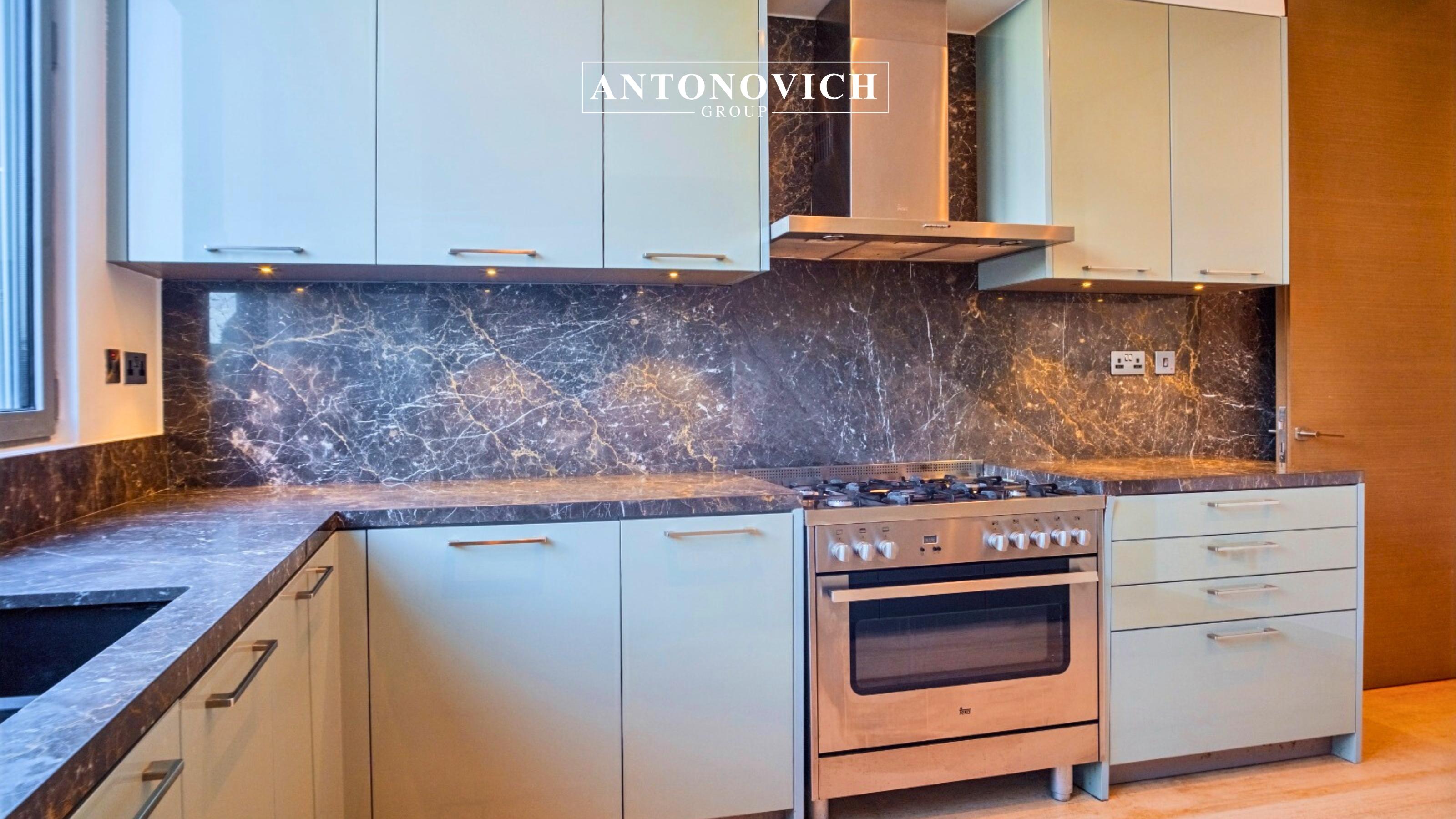 Bespoke Kitchen Joinery Solutions for Luxury Palm Jumeirah Villas Complementing the grand living room, the villa’s kitchen interior was designed as a refined extension of the modern luxury concept. Antonovich Group delivered a fully customized kitchen joinery solution tailored specifically for this Palm Jumeirah luxury villa, combining aesthetics, functionality, and precision craftsmanship. The kitchen features bespoke joinery, produced in Antonovich Group’s own furniture and joinery facilities, ensuring absolute control over quality and detailing. Custom cabinetry was designed with clean architectural lines, premium finishes, and seamless integration of high-end appliances. Natural wood veneers, lacquered panels, and stone countertops were carefully selected to harmonize with the villa’s modern interior palette. Every detail—from concealed storage systems to soft-close mechanisms—reflects Antonovich Group’s reputation as a leader in luxury kitchen design and joinery in Palm Jumeirah Dubai. The result is a kitchen that functions as both a high-performance culinary space and a sophisticated design statement, ideal for luxury villa living. SEO niche keywords integrated include: Luxury kitchen joinery Palm Jumeirah Custom kitchen design Dubai Bespoke kitchen interiors Palm Jumeirah High-end villa kitchen Dubai Private Home Cinema Interior Design: A Luxury Entertainment Experience In addition to the main living areas, Antonovich Group designed and executed a private home cinema interior that elevates entertainment to a new level of luxury. Designed exclusively for this modern luxury villa in Palm Jumeirah, the home cinema combines advanced technology with refined interior aesthetics. The space was acoustically engineered to ensure optimal sound performance, with wall treatments, ceiling panels, and flooring finishes carefully selected to enhance audio quality. Custom-designed seating, upholstered in premium materials, provides maximum comfort while maintaining visual elegance. Lighting was strategically layered to create a cinematic atmosphere, while bespoke wall cladding and joinery details reinforce the villa’s modern luxury identity. This meticulous approach demonstrates Antonovich Group’s expertise in luxury home cinema interior design in Dubai, where comfort, technology, and design coexist seamlessly. Bespoke Kitchen Joinery Solutions for Luxury Palm Jumeirah Villas Complementing the grand living room, the villa’s kitchen interior was designed as a refined extension of the modern luxury concept. Antonovich Group delivered a fully customized kitchen joinery solution tailored specifically for this Palm Jumeirah luxury villa, combining aesthetics, functionality, and precision craftsmanship. The kitchen features bespoke joinery, produced in Antonovich Group’s own furniture and joinery facilities, ensuring absolute control over quality and detailing. Custom cabinetry was designed with clean architectural lines, premium finishes, and seamless integration of high-end appliances. Natural wood veneers, lacquered panels, and stone countertops were carefully selected to harmonize with the villa’s modern interior palette. Every detail—from concealed storage systems to soft-close mechanisms—reflects Antonovich Group’s reputation as a leader in luxury kitchen design and joinery in Palm Jumeirah Dubai. The result is a kitchen that functions as both a high-performance culinary space and a sophisticated design statement, ideal for luxury villa living. SEO niche keywords integrated include: Luxury kitchen joinery Palm Jumeirah Custom kitchen design Dubai Bespoke kitchen interiors Palm Jumeirah High-end villa kitchen Dubai Private Home Cinema Interior Design: A Luxury Entertainment Experience In addition to the main living areas, Antonovich Group designed and executed a private home cinema interior that elevates entertainment to a new level of luxury. Designed exclusively for this modern luxury villa in Palm Jumeirah, the home cinema combines advanced technology with refined interior aesthetics. The space was acoustically engineered to ensure optimal sound performance, with wall treatments, ceiling panels, and flooring finishes carefully selected to enhance audio quality. Custom-designed seating, upholstered in premium materials, provides maximum comfort while maintaining visual elegance. Lighting was strategically layered to create a cinematic atmosphere, while bespoke wall cladding and joinery details reinforce the villa’s modern luxury identity. This meticulous approach demonstrates Antonovich Group’s expertise in luxury home cinema interior design in Dubai, where comfort, technology, and design coexist seamlessly.