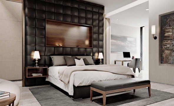 The picture appears to be a close-up of a colorful mosaic wall. The mosaic consists of various shapes and patterns, including circles, squares, and triangles in several different colors.