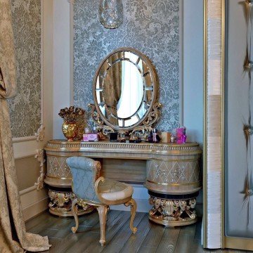 This picture shows a colorful abstract painting. The painting consists of bright, fluid brushstrokes of many different colors such as yellow, blue, green, and red. The painting has a somewhat chaotic and free-flowing feel to it, with no clear focal point.