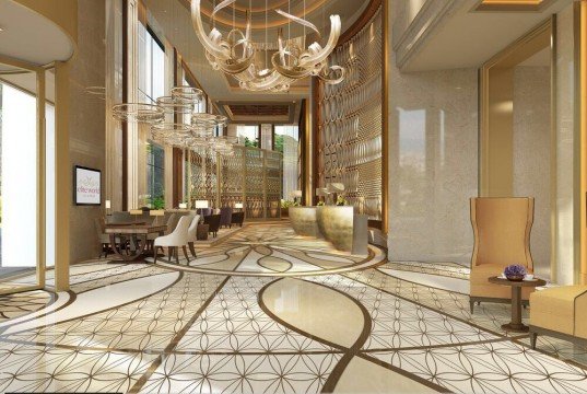 This picture shows a close-up of an old stone wall. The stones are very weathered and there is some moss growing in between them. The wall looks like it has been there for many years and has seen a lot of wear and tear.