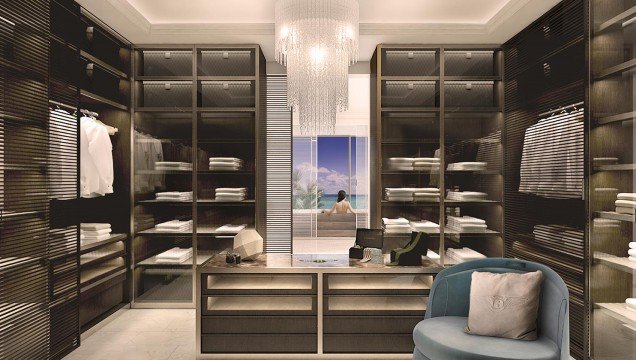 The picture shows a person in the center, wearing blue and white clothing, surrounded by a group of people with their arms outstretched in a circular formation. The person in the middle appears to be leading the group.