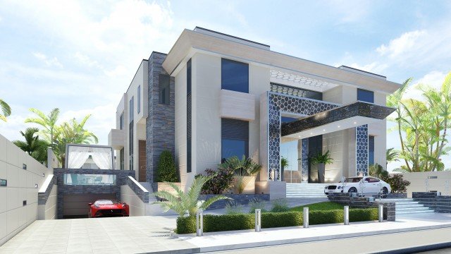 This picture is of a white and yellow rose in full bloom, with delicate pink and yellow petals and a vibrant yellow center. The flower is surrounded by lush green foliage and soft wispy grass.