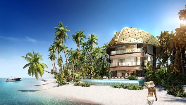 This picture shows a close-up of a red and orange maple leaf with a drop of water on its surface. The bright colors of the leaf are highlighted by the water droplet, which also serves to emphasize the intricate and detailed veins of the leaf.