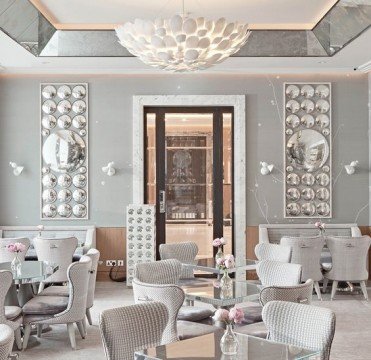 This picture is of an erupting volcano. The volcano is spewing out ash and smoke, with orange lava glowing in the background. There is a bright orange glow in the sky above the volcano, indicating the intensity of the eruption.