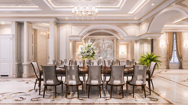 This picture shows a woman wearing a black and white striped top, with her arms crossed and a serious look on her face. She has long dark hair and is standing in front of a white wall.