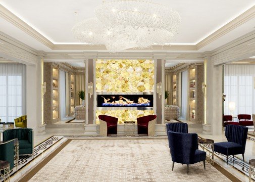 Modern open kitchen with large island featuring marble countertop, white cabinetry, and stainless steel appliances.