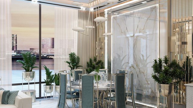 Two luxurious armchairs upholstered in white leather, with curved backs and brass accents.