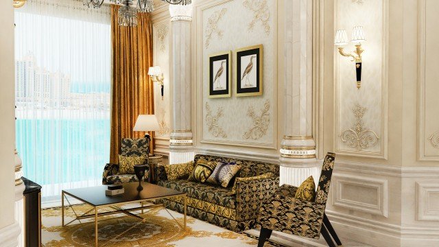 A traditional living room with ornate furnishings and lavish design elements including molded cornices, ceiling accents, and intricate carved moldings.