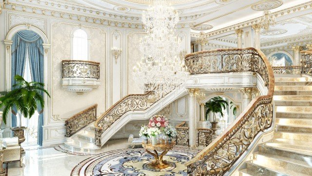 This picture shows a large, modern kitchen with an island in the center surrounded by marble countertops and light wood cabinetry. The cabinets on the wall are fitted with glass doors, allowing light to enter the space, while the large windows on either side of the kitchen provide plenty of natural light. The flooring is light-colored stone tiles, creating a bright and airy atmosphere.