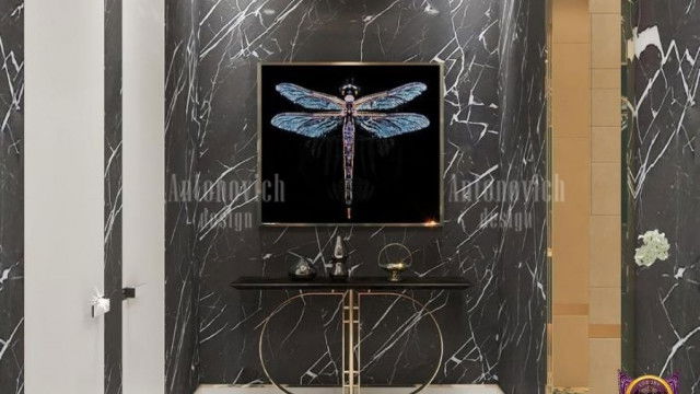 This picture shows a modern white living room with a sectional sofa, a glass coffee table, and an abstract painting on the wall. The furniture is arranged to create a spacious and inviting atmosphere. The light grey walls and white trim create an airy and minimalist feel. There are large windows that allow natural light to fill the space, as well as recessed lighting for additional illumination.