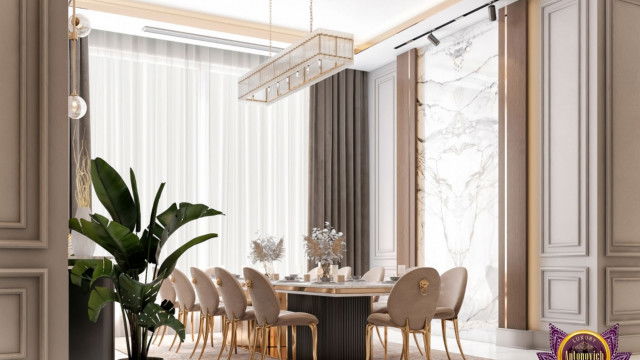 This picture shows the interior of a contemporary living room. The room is decorated with sleek, modern furniture and decorative accents in neutral shades, including light grey walls, a white sofa, and a black, glossy coffee table. On one side of the room is a contemporary fireplace, with a surrounding mantlepiece that is decorated with art pieces and plants.