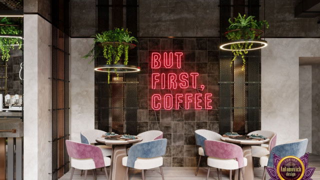 This picture shows an elegantly designed living room in a modern style. The room has a beige and white color palette with accents of gold. The square-patterned rug provides a nice focal point, while the comfortable sofa and armchairs are situated around it. The room also features a fireplace with a white marble mantle, and a large window that looks out onto a lush garden.