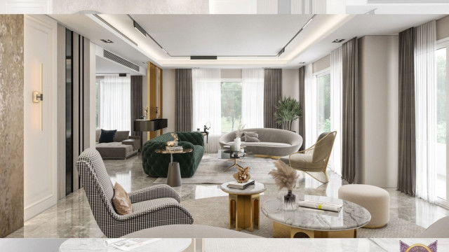 This picture shows a modern dining room, featuring a large round wooden dining table with six chairs. There is a chandelier above the table, and a small accent table with a potted plant next to the window. The walls are painted in a light gray hue, with white trim, and the floor is covered in dark hardwood. There is an area rug under the table and a large abstract painting on the wall.