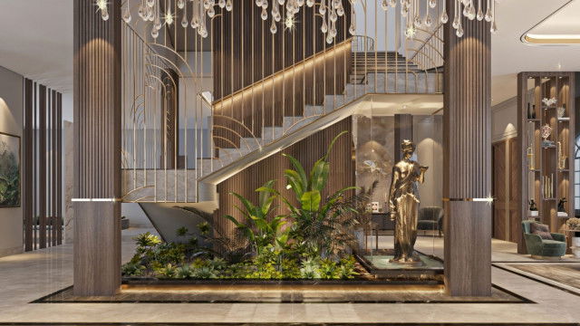 This picture shows an ornate and luxurious living room in a large traditional Russian home. The room is decorated with plush carpets, large wall art featuring classic and antique designs, large gold-framed mirrors, and a grand chandelier. There are two large sofas upholstered in velvet and trimmed with gilded trim details, along with several accent chairs and a vintage piano. Overall, this room exudes elegance and old-world charm.