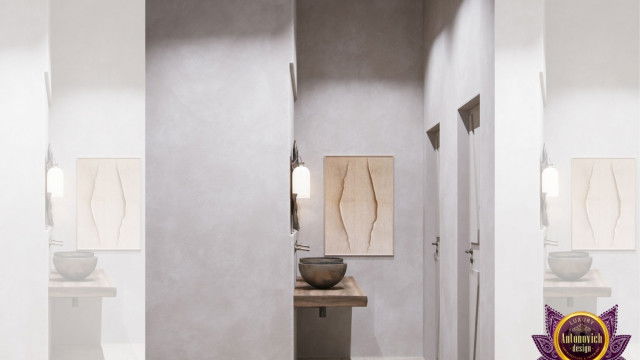 Modern office with a large open-plan workspace, multiple computer workstations, wall-mounted flat-screen monitors, and contemporary furniture.