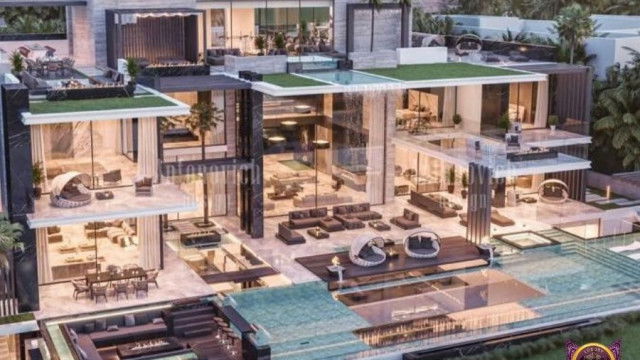 The picture shows a luxurious living room setting, featuring a grand piano and seating area. The walls and furniture in the room are decorated with white and gold accents, giving off an opulent and sophisticated feel. The large, arched windows allow for plenty of natural light, while the hardwood floor adds to the luxurious atmosphere. A large chandelier hangs from the ceiling, adding a touch of glamour and elegance to the space.