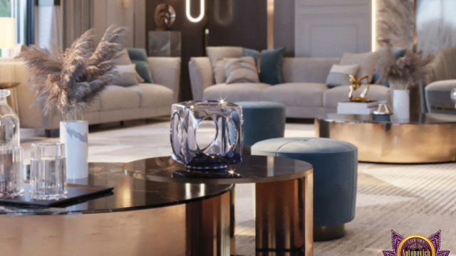 The picture shows a modern luxury living room designed by Antonovich Design. It features light grey walls with white paneling, a marble fireplace, and comfortable seating areas with mid-century modern styling. There are two large windows that provide plenty of natural light, as well as a statement piece wall art and decorative light fixtures. The room has a neutral color palette with hints of yellow and blue for accents, creating a bright and inviting atmosphere.