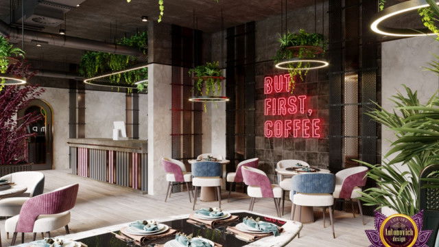 This picture is a modern luxurious bedroom designed by the company Antonovich Design. The room features a grey and white color palette with intricate gold and marble accents. The bed is covered in plush velvet fabrics with a large gold headboard. A velvet tufted ottoman sits at the foot of the bed, while a white tufted chaise lounge seat sits near the window. On the opposite side of the room, there is a white vanity with a large mirror, ornate gold chairs, and an abstract art sculpture hanging on the wall. A unique chandelier hangs from the