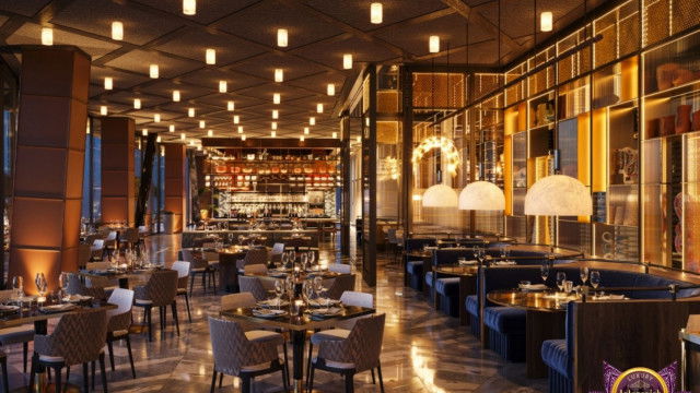 The picture shows a luxurious living room with a curved marble floor, a dark wooden console table with a large mirror, and a cream-colored sofa with matching armchairs. Two coffee tables in different finishes have been placed between the furniture pieces, creating a warm atmosphere. Several pieces of art and cushions have been added for an extra touch of sophistication. The overall decor has a neutral palette and the lighting is soft and subtle, making it a perfect setting for relaxation.