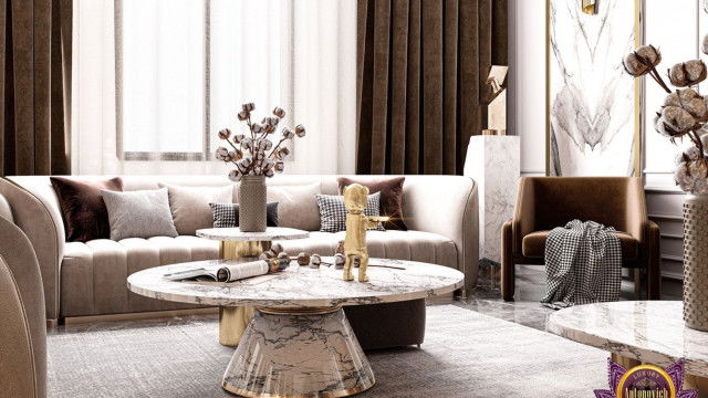 This picture shows a modern, spacious living room with an intricate ceiling design featuring recessed lighting. The furniture is an elegant combination of black and white, with a comfortable sectional sofa, a marble coffee table, and two armchairs. Above the fireplace, there is an ornate wall sconce and artwork that adds an opulent touch to the space.