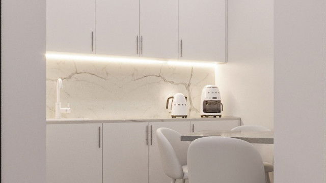 This picture shows a luxurious master bedroom with a gold and white color scheme. The walls are painted white and feature an ornate gold patterned wallpaper, while the floors are covered in a gold-patterned rug. The bed is also dressed in golden tones, with a velvet tufted headboard and crisp white sheets. A large round mirror hangs above the bed and gleaming gold nightstands are located on either side, adding to the overall opulence of the room.