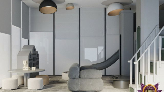 The picture shows a modern, contemporary living room design with a large, plush L-shaped sofa set in the center. The elements in the design are arranged in a balanced and symmetrical fashion with two matching arm chairs on either side of the sofa and a glass coffee table in the center. The walls are painted in a light gray color with several abstract art pieces in vibrant colors hung around the room. The flooring is wooden parquet and there are several potted plants scattered around.