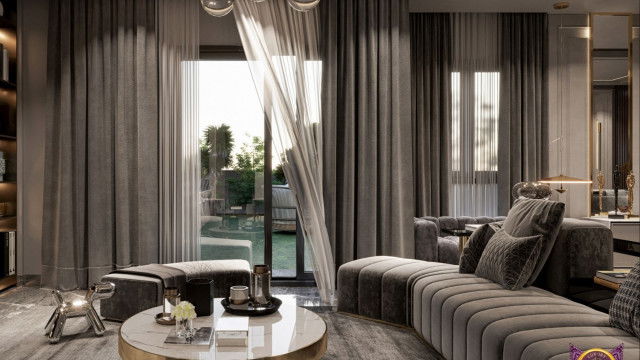 This picture is of an elegantly designed dining room featuring an ornately detailed ceiling, luxurious window treatments, beautiful chandelier lighting, and a dramatic table setting for a formal dinner. The walls are covered in a light beige fabric with subtle striped accents, while the furniture is classic and traditional in style, with lush upholstery in shades of creamy white and light espresso brown.