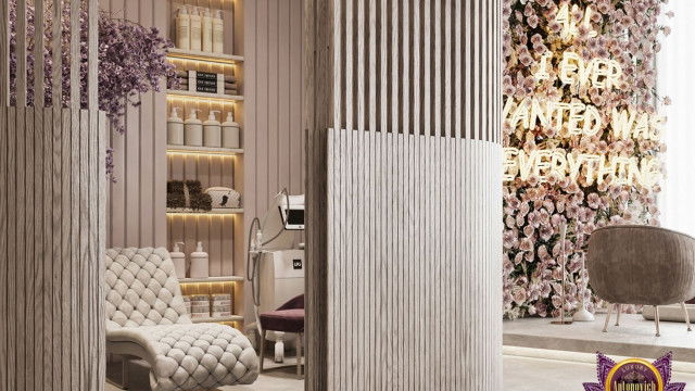 This picture shows a modern, luxurious living room with a large, light-colored sectional sofa along the wall. The walls are decorated with dark wood paneling and abstract canvases. There is an abstract area rug in front of the sofa and a round glass coffee table in the center of the room. The room also has floor-to-ceiling windows and crystal chandeliers that give it a glamorous feel.