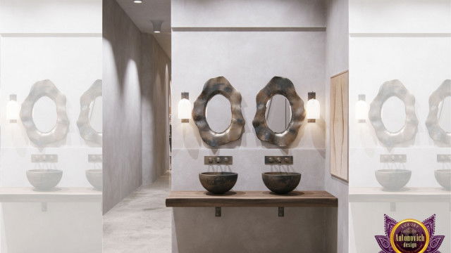 A modern high-end interior featuring an elegant and curved upholstered sofa set, a vibrant area rug, and a side console table with decorative accents.