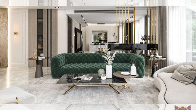 This picture shows a modern style living room. The room has an open floor plan and utilizes neutral colors throughout, such as white walls with accents of light gray, brown and beige. There is a cozy seating area featuring a sectional sofa, a large armchair and a glass coffee table. A decorative area rug lies beneath the seating area and ties together the space. On the opposite side of the room from the seating area is an entertainment center with a wall mounted flat screen television and shelves for storing books, magazines and other items.