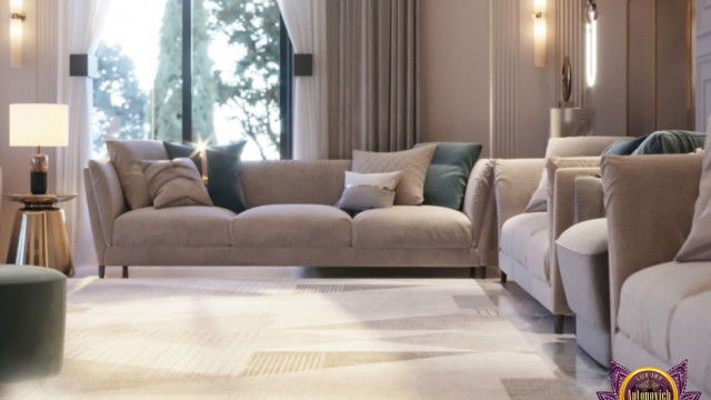 This picture is showing a luxurious bedroom interior designed by Antonovich Design. The room features a dramatic dark blue velvet bed with ornate detailing, subtly lit by crystal chandeliers. A large black fireplace stands in the corner, surrounded by elegant wall accents and artwork. The walls are painted in a deep navy blue color, with a coordinating patterned rug covering the floors.