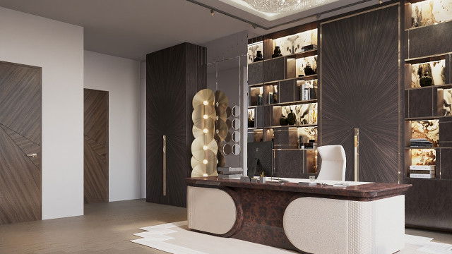 This picture shows a luxurious, open-concept living room. The walls are painted in a pastel yellow color and have white trim. The furniture is composed of a brown-colored sofa and armchair with a glass-top coffee table between them. The floor is covered in cream-colored carpeting, and there is a large crystal chandelier hanging from the ceiling. There are several potted plants scattered throughout the room, providing a pop of greenery in the airy space.