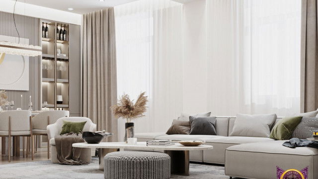 This picture shows a modern and luxury bathroom design. It features marble walls, a large whirlpool bathtub, two sinks, and two large mirrors. The floor is made of pebbles and there is a bench on the side for added seating. A wide glass shower stall is located on the opposite side of the room from the bathtub. The room is finished with warm lighting, giving it a cozy atmosphere.