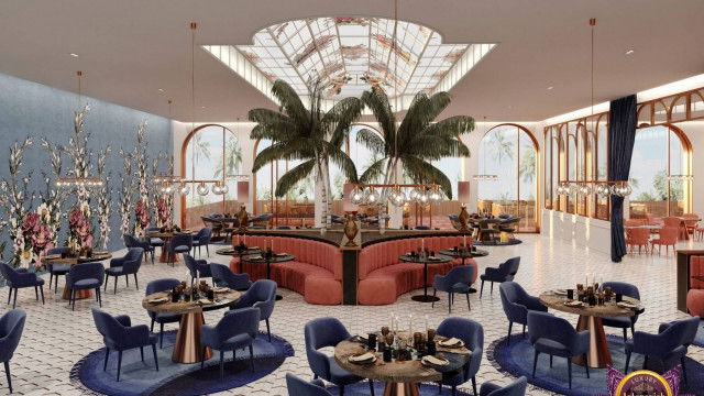 This picture shows a modern home office with a luxurious design. The walls are finished with warm colors and intricate patterns. There is a solid white desk in the center of the room with a matching chair and lamp. On the wall behind the desk is a large abstract painting in shades of blue, green and purple. To the right of the desk are two floor-length windows with sheer white curtains and a row of low bookshelves filled with various items.