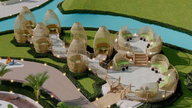 This photograph shows an ornate design of a ceiling in an interior space. The white and gold ceiling features intricately carved wood details that are accentuated by intricate gold leaf gilding around the edges of the panels and in the center of the ceiling. The design is composed of several symmetrical geometric shapes, including circles, diamonds, and squares. There is an ornamental chandelier hanging from the center of the ceiling and light fixtures along the sides.