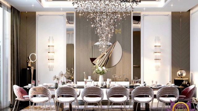 Modern living room design featuring an ivory-colored sofa, golden-accented chairs, and an ornate rug.