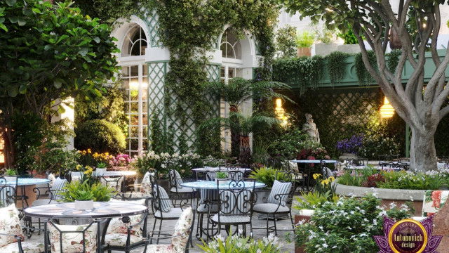 Modern interior design featuring a grand chandelier surrounded by white walls and classic furniture.