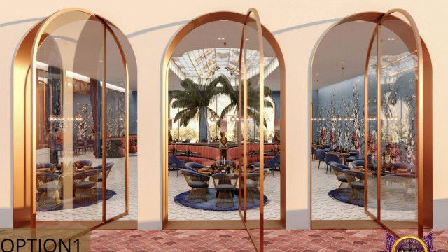 This picture is of a high-end modern living room. The room features sleek, minimalist furnishings and luxurious accents, such as a black velvet sectional sofa and a mirrored glass coffee table. The walls are painted in a neutral shade, allowing the focus to remain on the furniture. The room also has indirect lighting, giving it an inviting and cozy atmosphere.