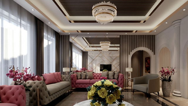 A modern interior with a cream-colored sofa and center table, flanked by two white armchairs placed against a grey wall with an artwork hung above.