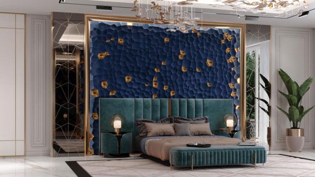 Grand staircase featuring ornate balustrades and handrails, with a central chandelier overhead.