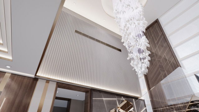 A contemporary minimalist living room featuring an upholstered white sofa, two glass-top occasional tables, an accent armchair, and an abstract wall art.