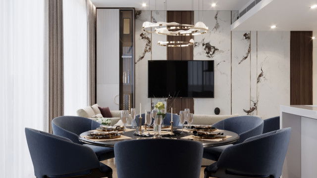 This picture shows a spacious and modern living room, featuring cream colored walls and contemporary furniture. The room has a large, curved sofa, two armchairs and a plush recliner, all upholstered in various shades of gray. In the corner of the room is a glass-top coffee table and a modern, sculptural floor lamp, which provides additional lighting. The room also features a large window providing lots of natural light.