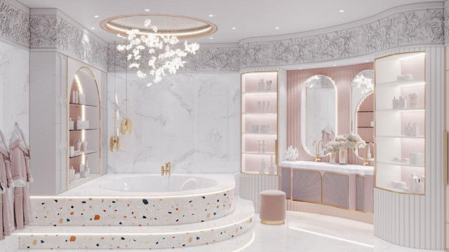 This picture appears to be a photograph of a modern interior design project. The space features several different seating arrangements, along with a substantial bar area to the right with marble countertops and decorative wall tile. There is a white sofa facing three green armchairs around a glass coffee table in the center of the room. The decor includes dark wood furniture, statement lighting, and a unique art piece on the wall.