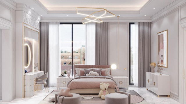 Modern apartment interior featuring an accent wall with geometric patterns, large windows, and a sofa with a patterned pillow.