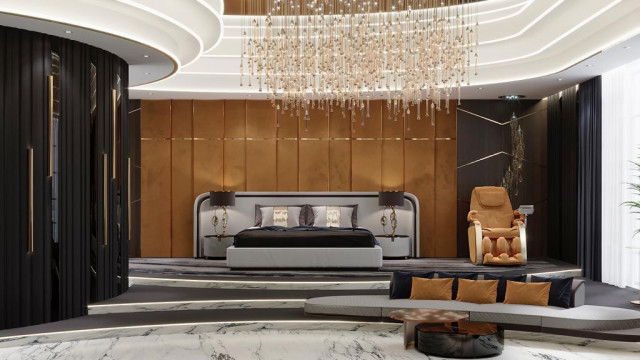 Modern living room with white furniture, featuring a comfortable sectional sofa, a round glass coffee table, and an accent wall decorated with family pictures.