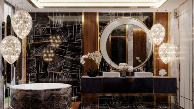 This picture shows an opulent living room with classic baroque-style decor. The walls and ceiling are painted in a floral print, while the floor is covered with an ornate dark rug. The furniture is made up of luxurious velvet couches, chairs and ottomans arranged around a grand fireplace. Various decorative pieces including a large chandelier, an intricately carved mirror and various sculptures are displayed around the room.